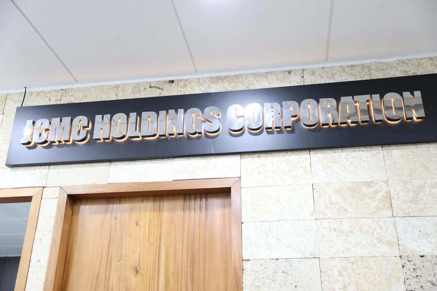 JCMCH Holdings Corporation office signage